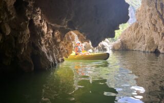 Family canoeing in the morning under the Pont d'Arc - from 3 years old